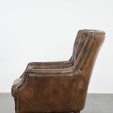 Very comfortable vintage cow leather armchair with beautiful colours