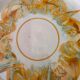 8 vintage dessert plates with a signed decoration.