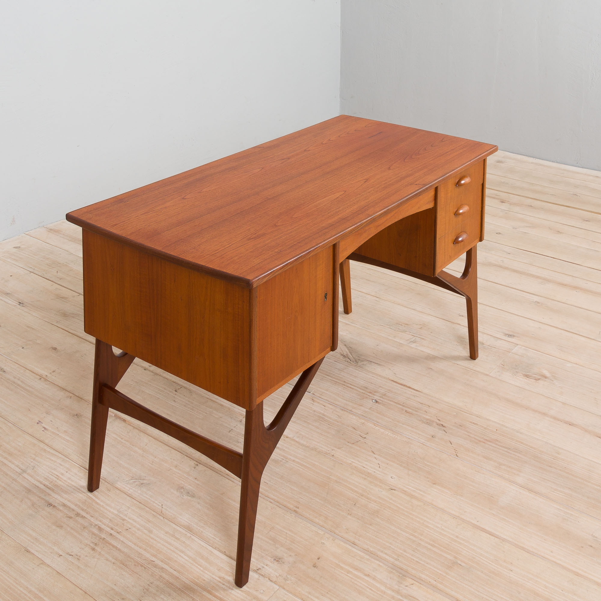 Danish mid century teak desk on sculptural base, 1960s.