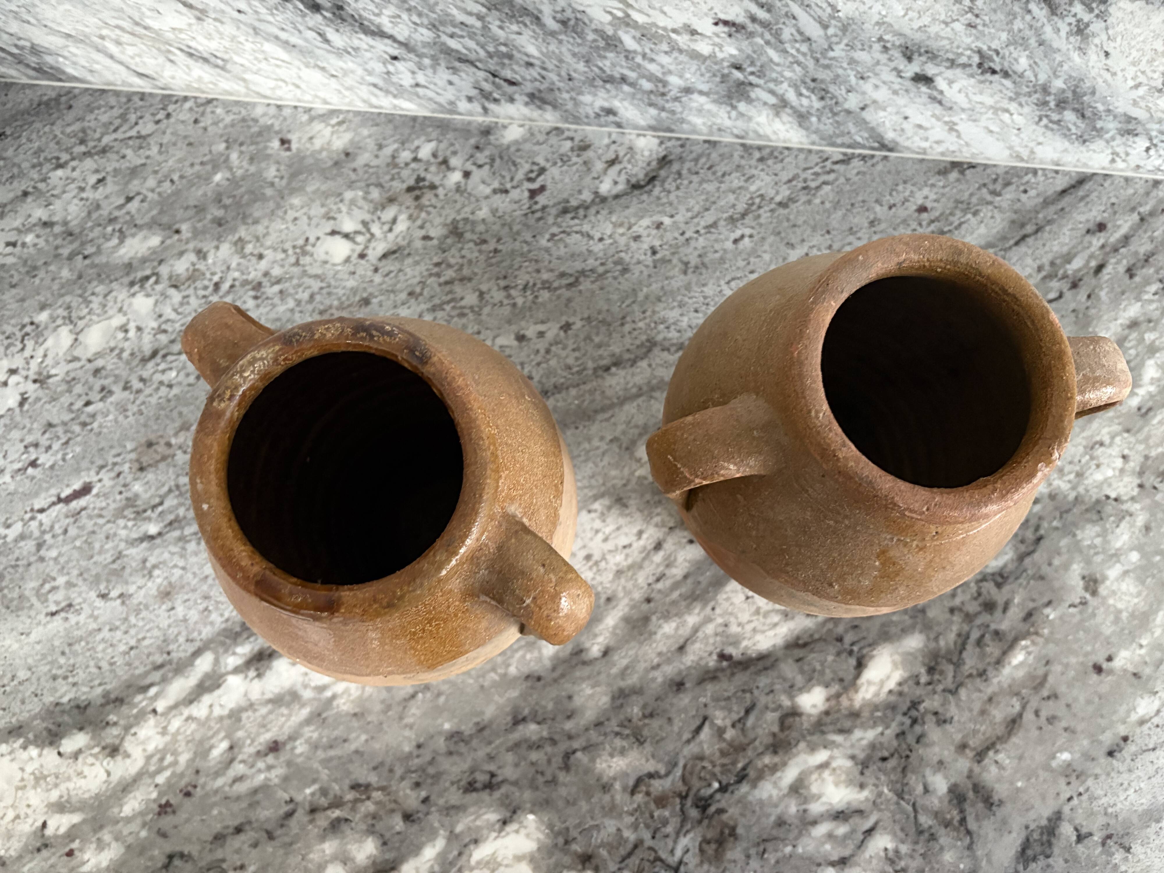 Pair of Provençal enamelled terracotta jars