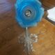 Art Deco style wall light in frosted blue glass with silver metal support.