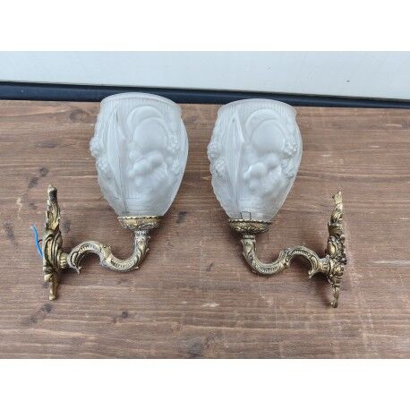 Pair of brass wall lights and glass paste.