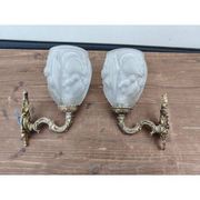 Pair of brass wall lights and glass paste.