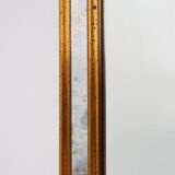 Mirror by Deknudt with marbled fume glass side panels in gilded wooden fram