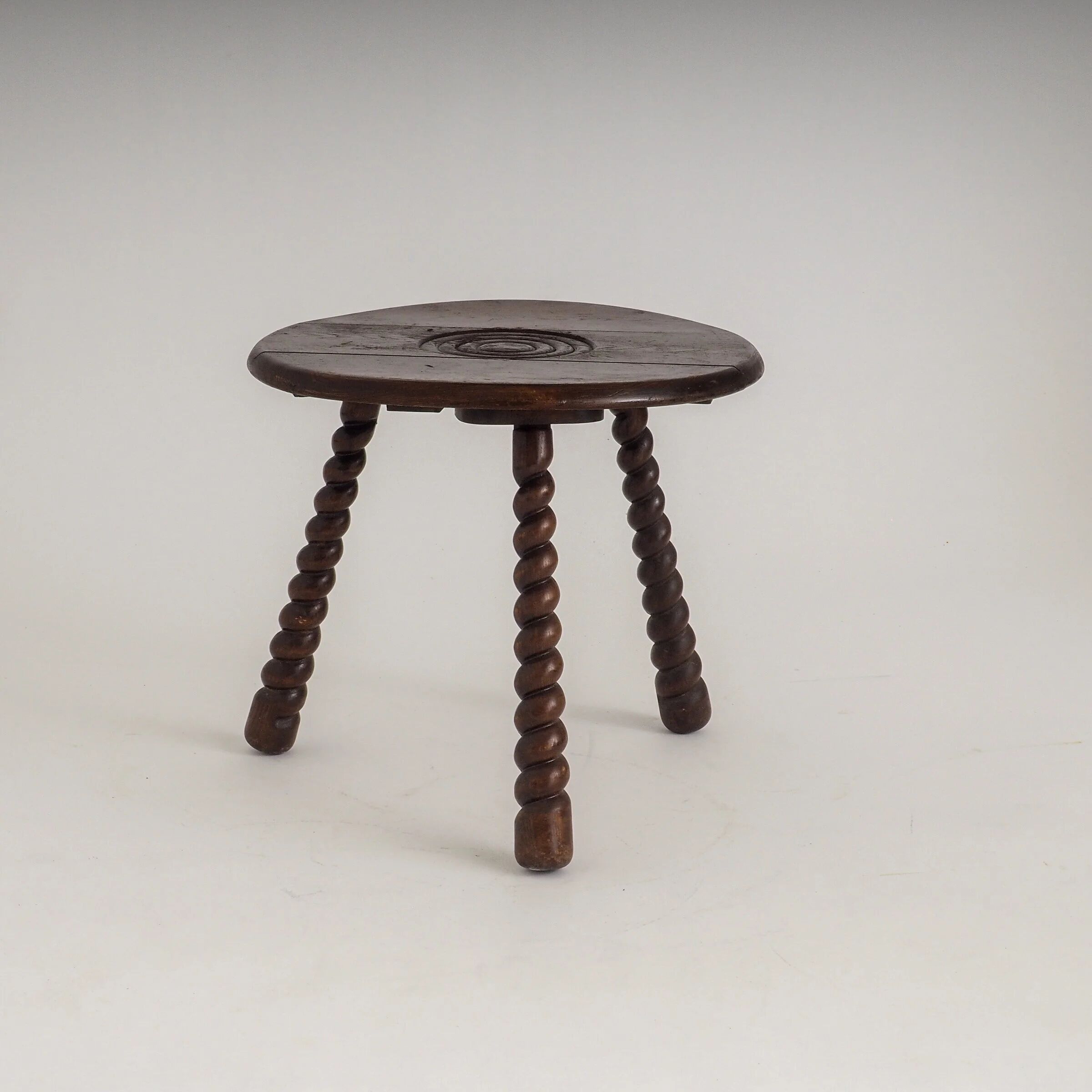 French oak tripod side table attributed to Charles Dudouyt