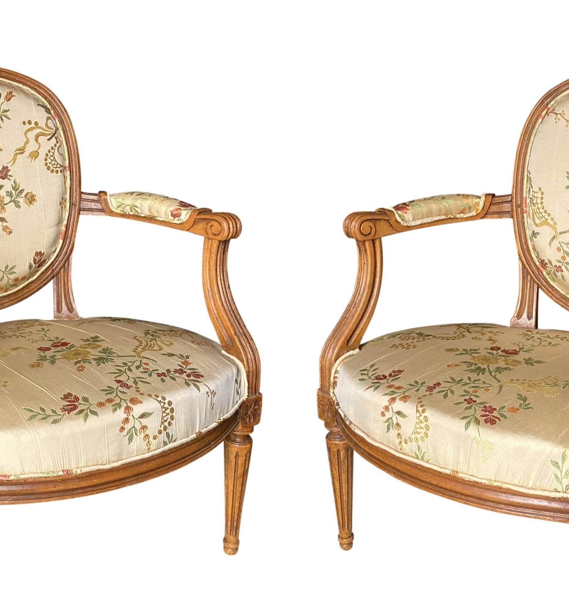 Pair of Louis XVI silk cabriolet armchairs