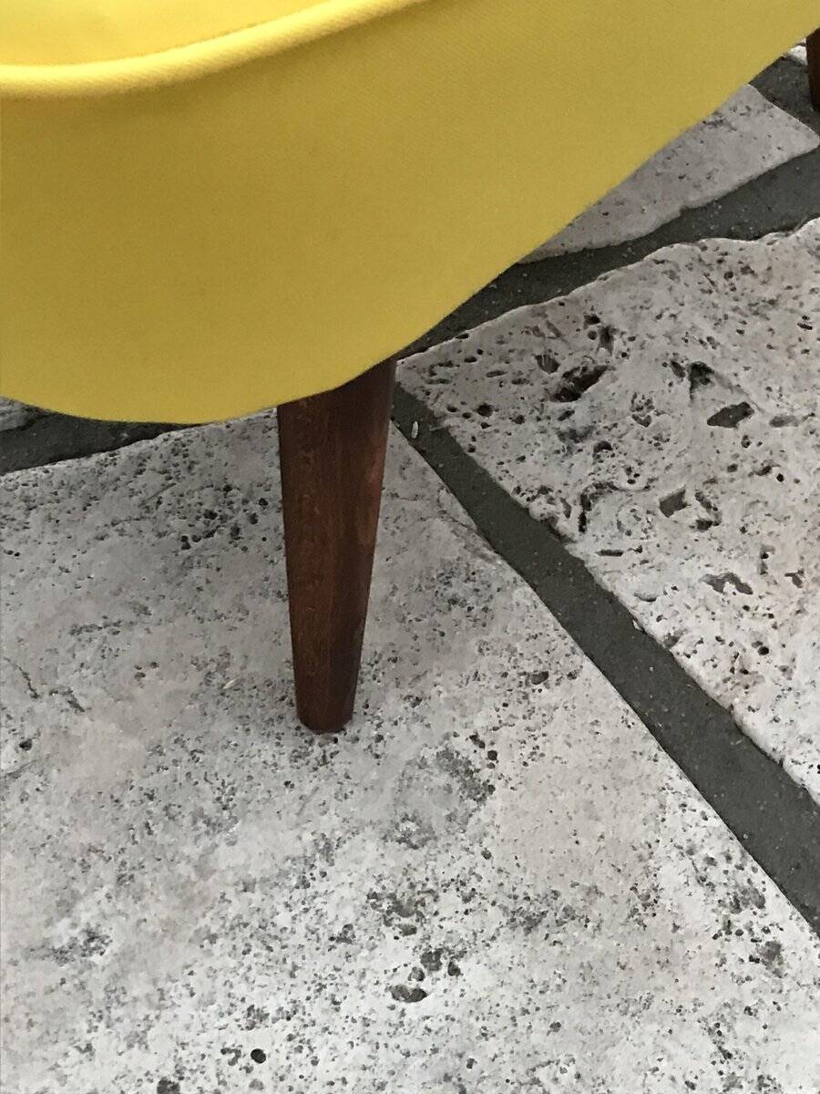 Yellow cocktail chair in solid beech, 1960s, with fluted backrest and tapered legs.