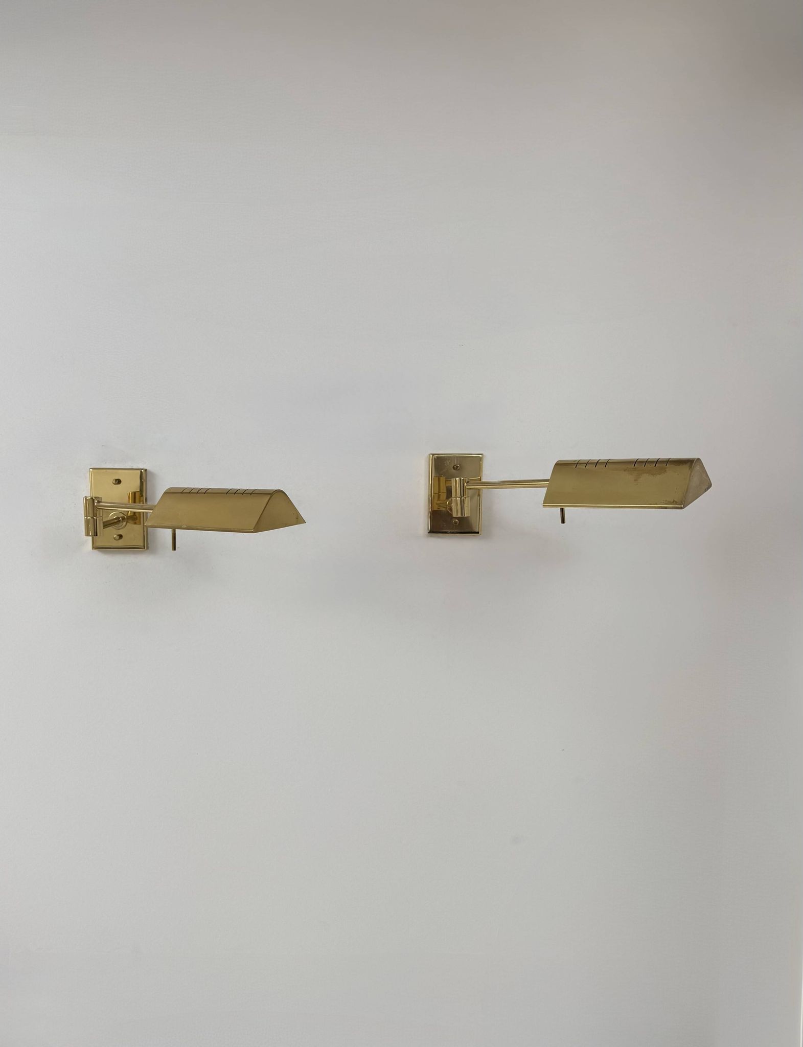 Pair of adjustable vintage wall lights, brass, France, 1970.