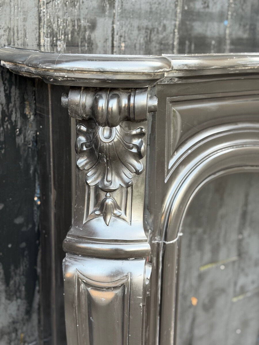 Louis XV style fireplace in black Belgian marble, circa 1880.