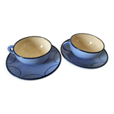 A pair of glazed ceramic cups and saucers from the 60s-70s.