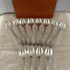 Art Deco oyster forks in punched silver metal, leatherette box