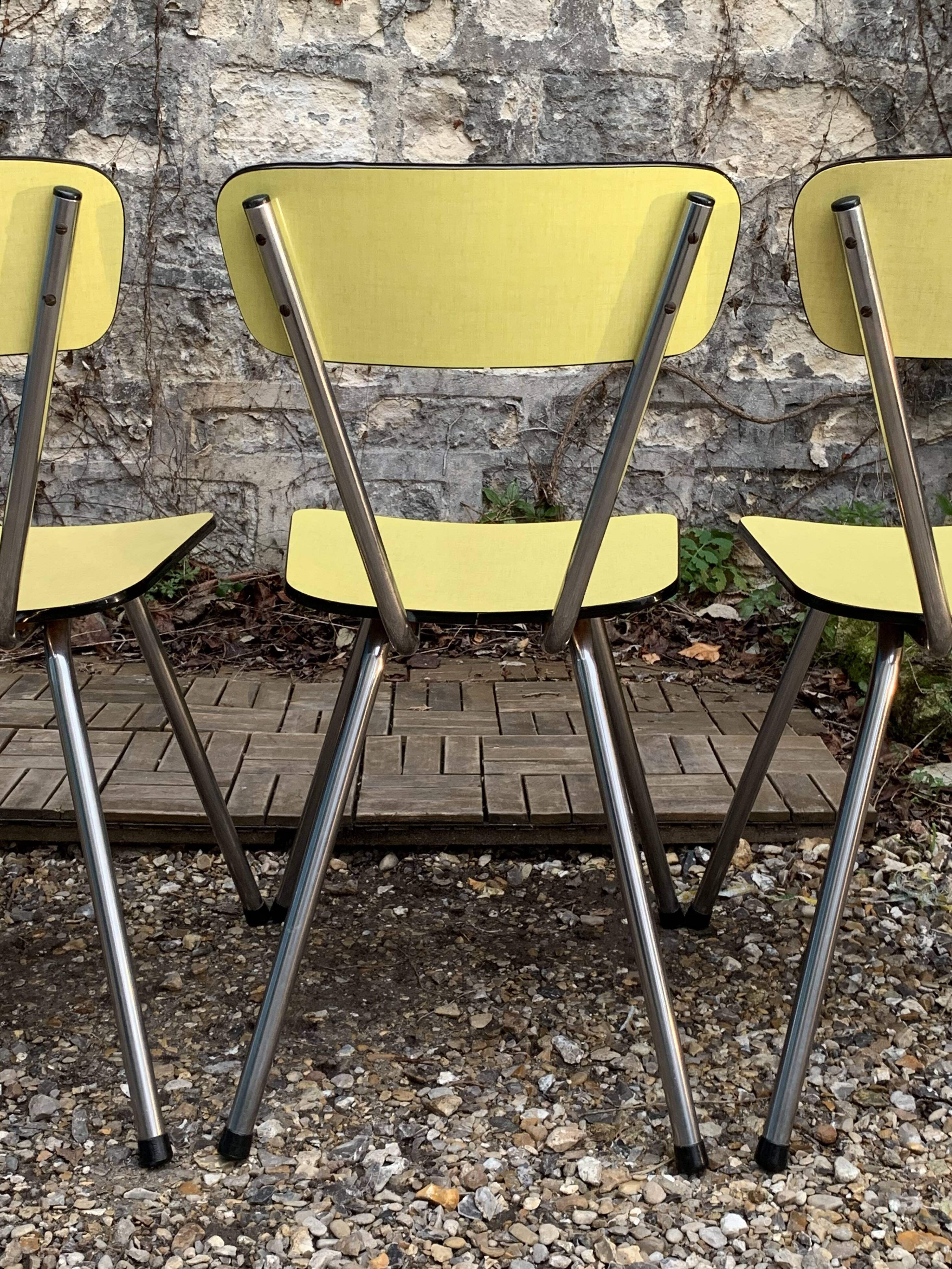 Yellow Formica chairs with compass legs, 1950s