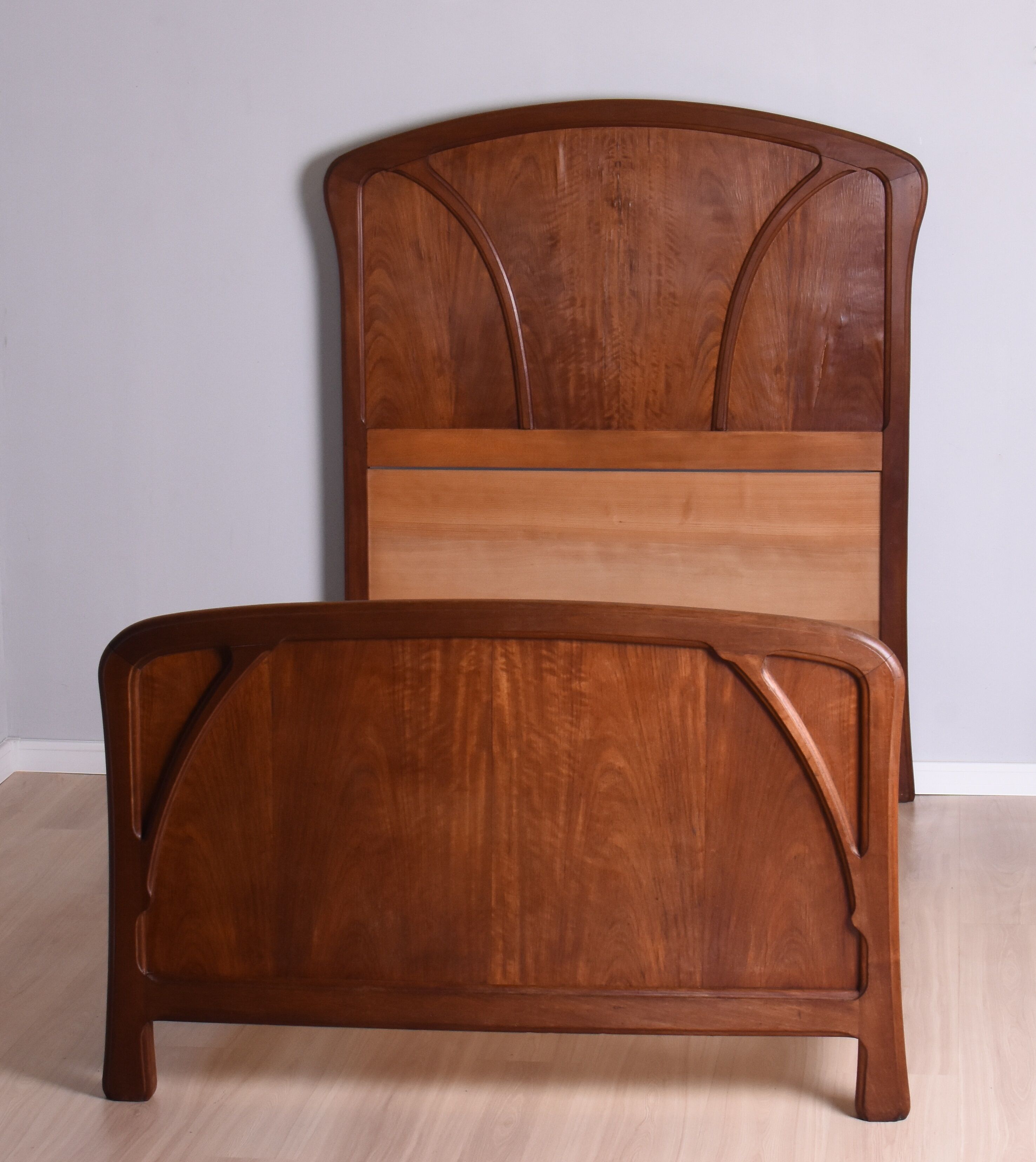 Wooden bed, early 20th century.