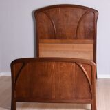 Wooden bed, early 20th century.