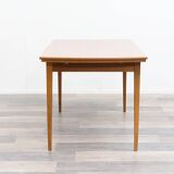 Dining table, 1960s, in walnut, slightly elliptical shape.