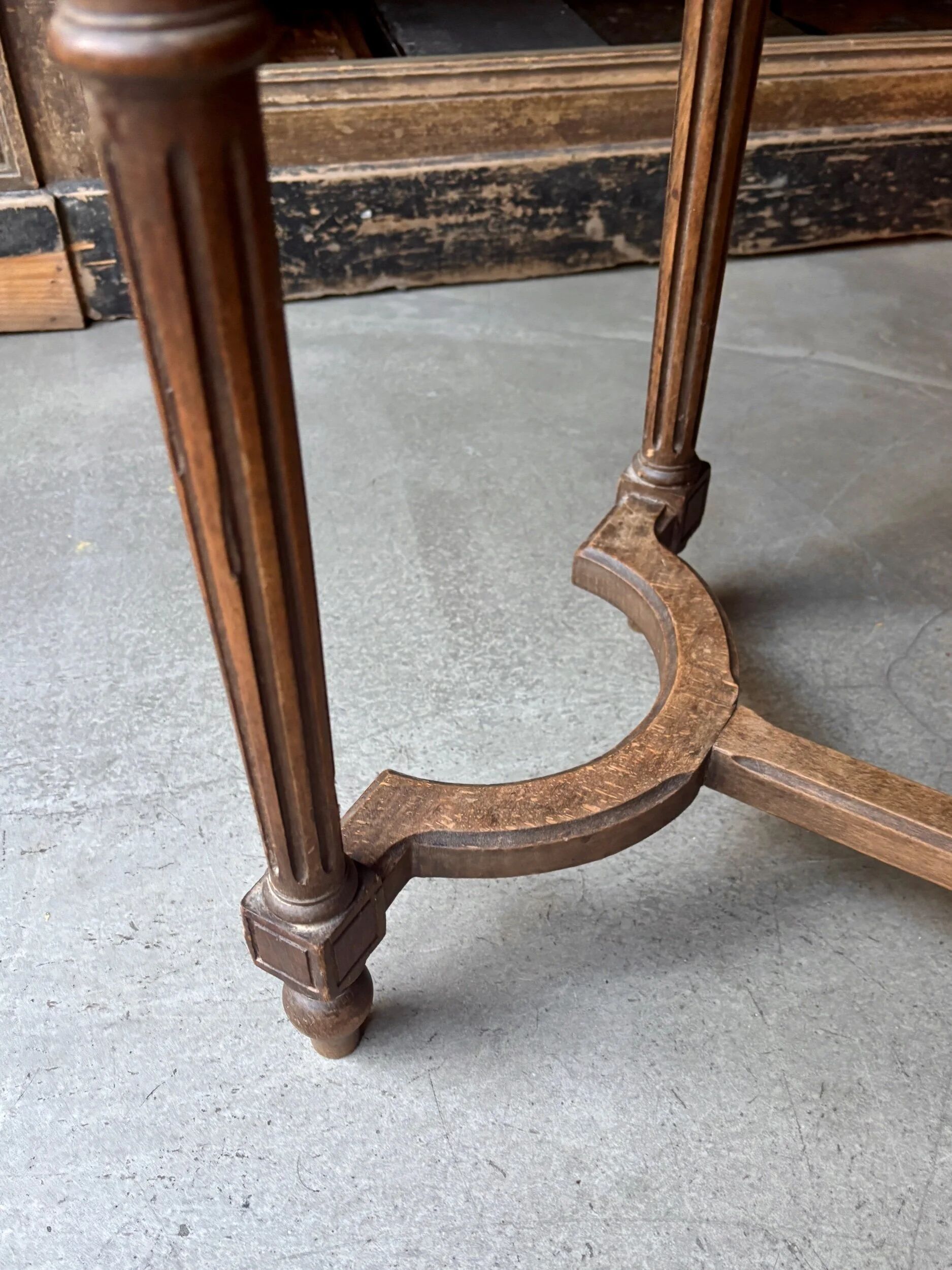 Stool, small wooden piano bench with carved details and caning.