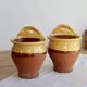 Pair of vintage wall planters in yellow glazed stoneware.