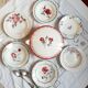 Mismatched old soup plates accompanied by a soup tureen