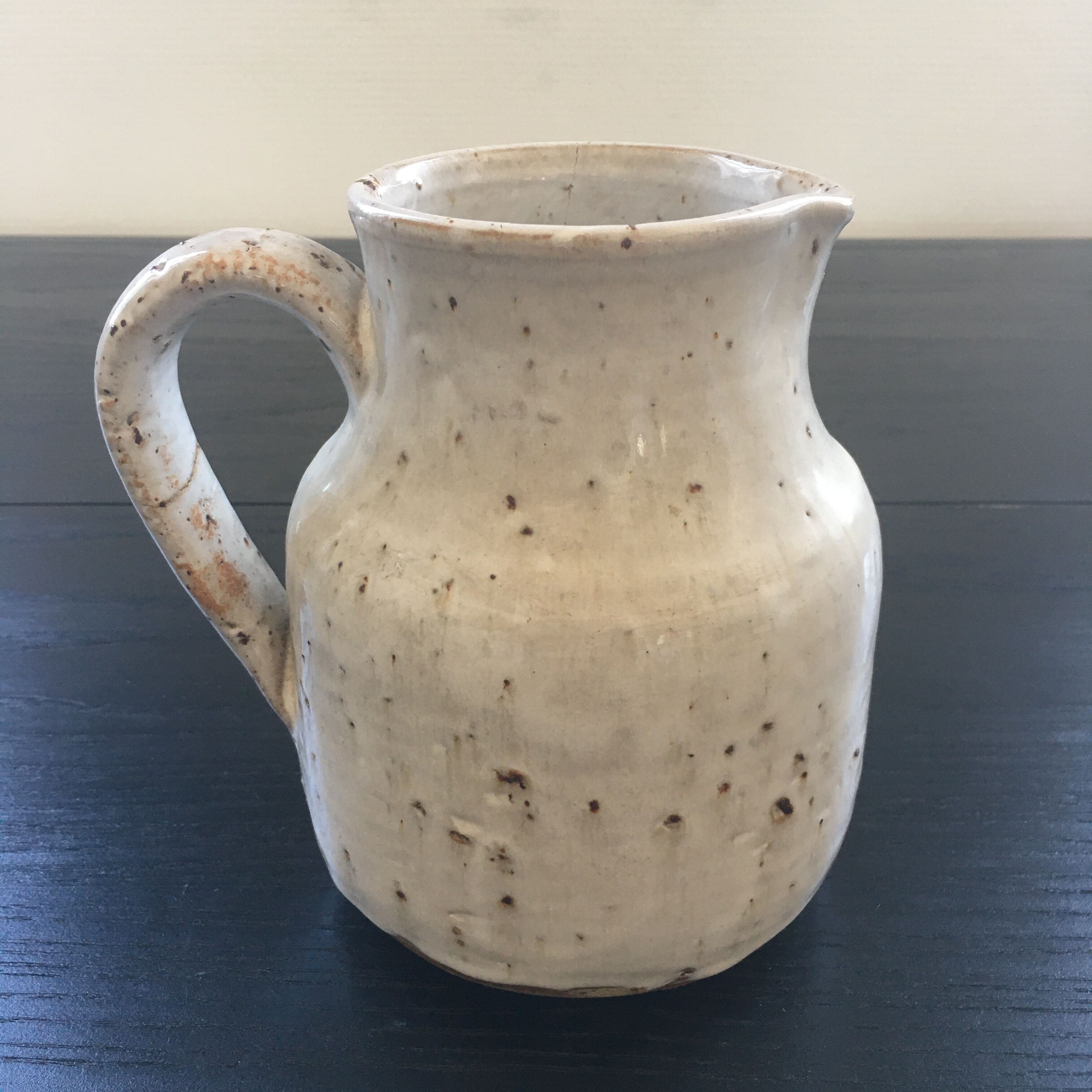 Old ivory stoneware jug