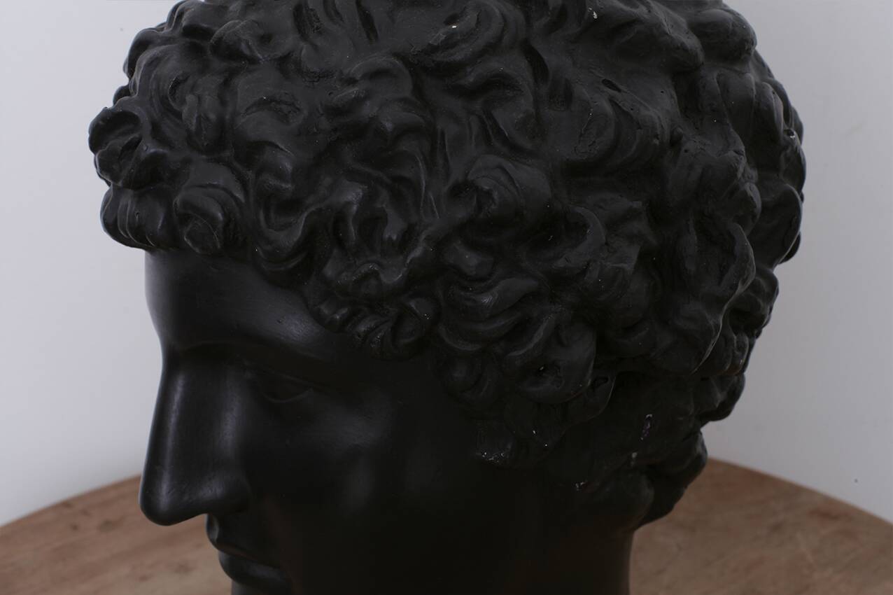 Greek head in waxed black plaster