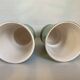 Pair of antique green and gold ceramic vases