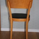 5 baumann chairs with large backs in black faux leather.