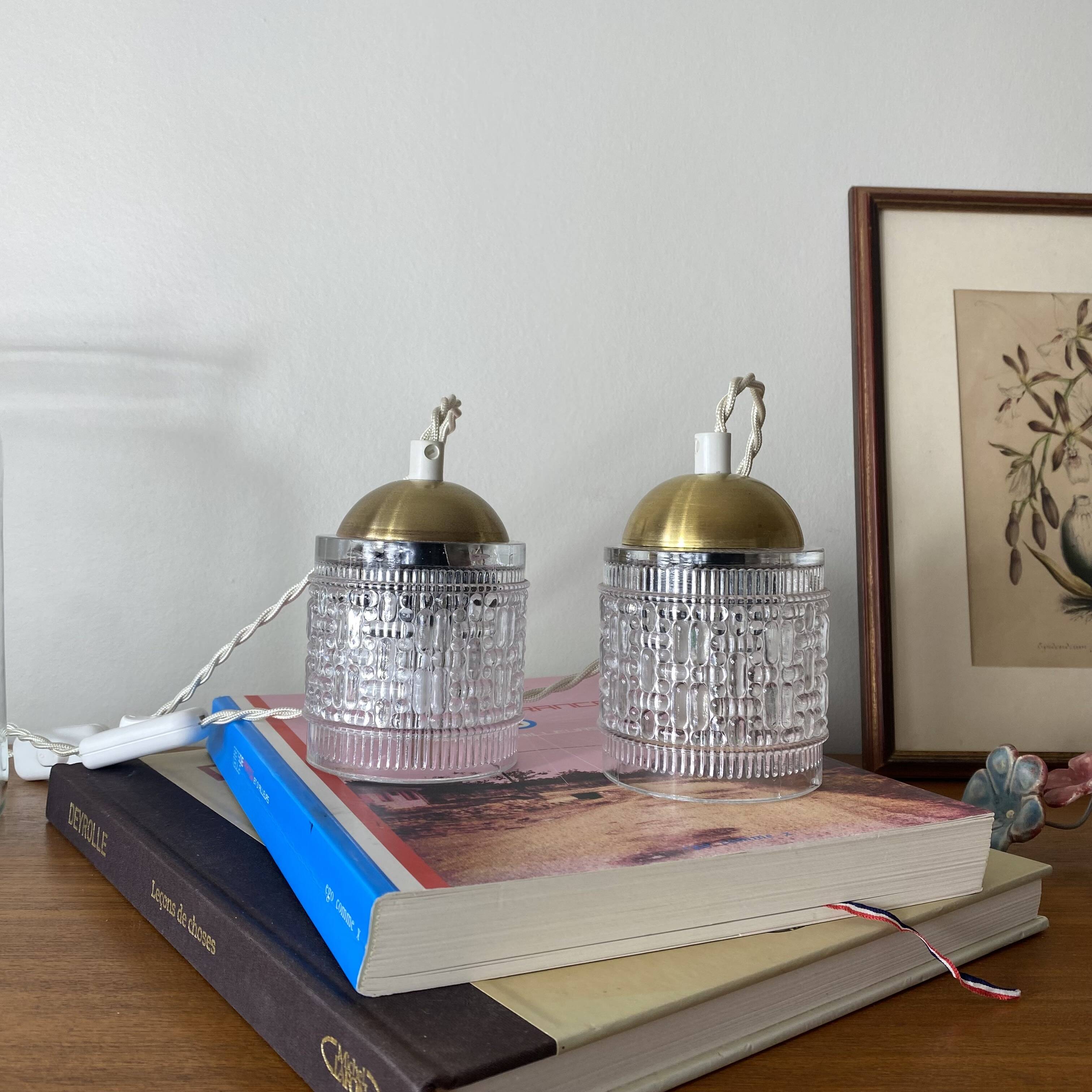 Pair of small portable tulip lamps in transparent glass.
