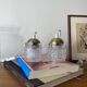 Pair of small portable tulip lamps in transparent glass.