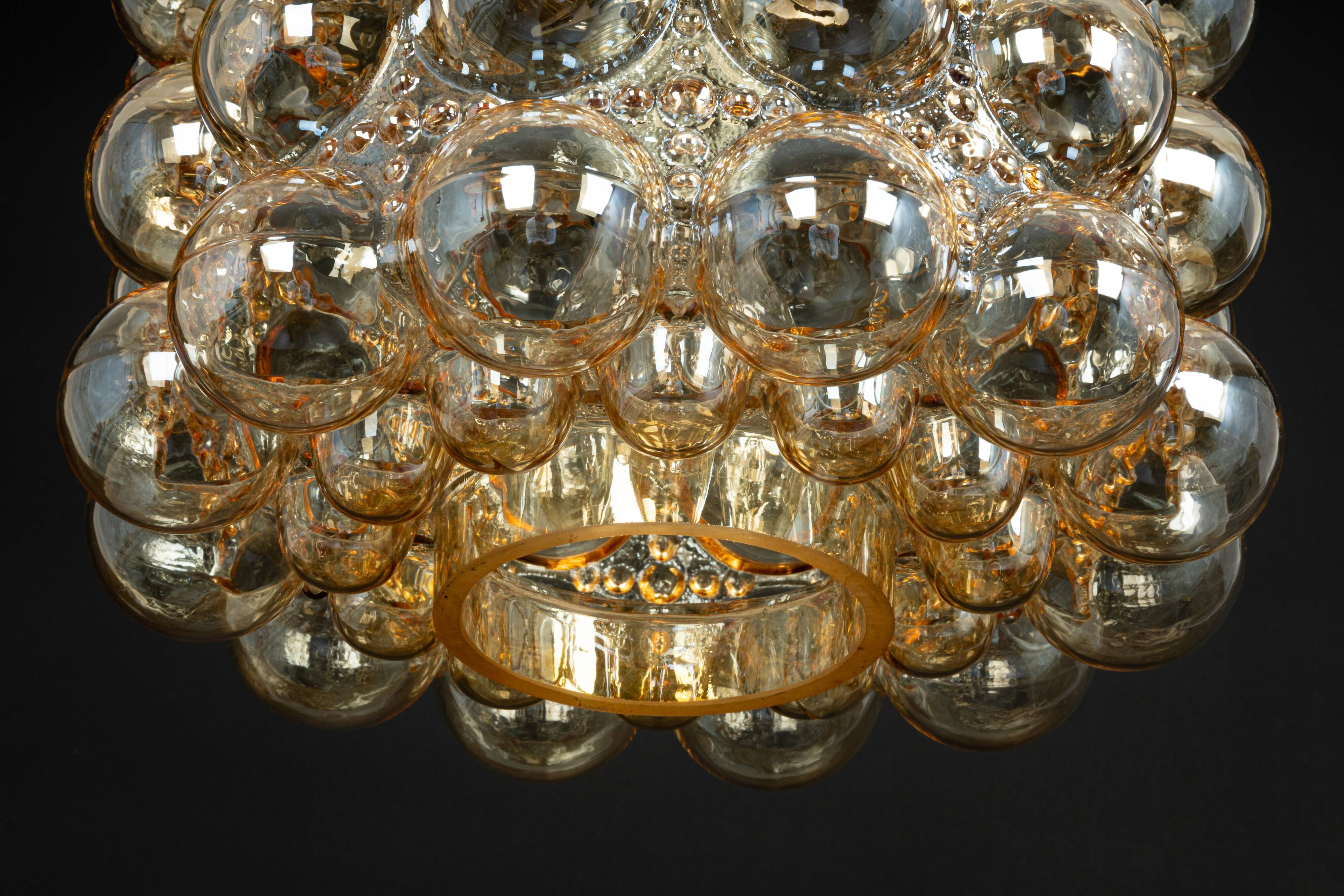 Large amber bubble glass pendant light by Helena Tynell for Limburg, Germany, 1970s.