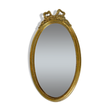 Golden oval mirror