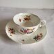 Antique Cup and Saucer in Porcelain with Hand-Painted Floral Decoration
