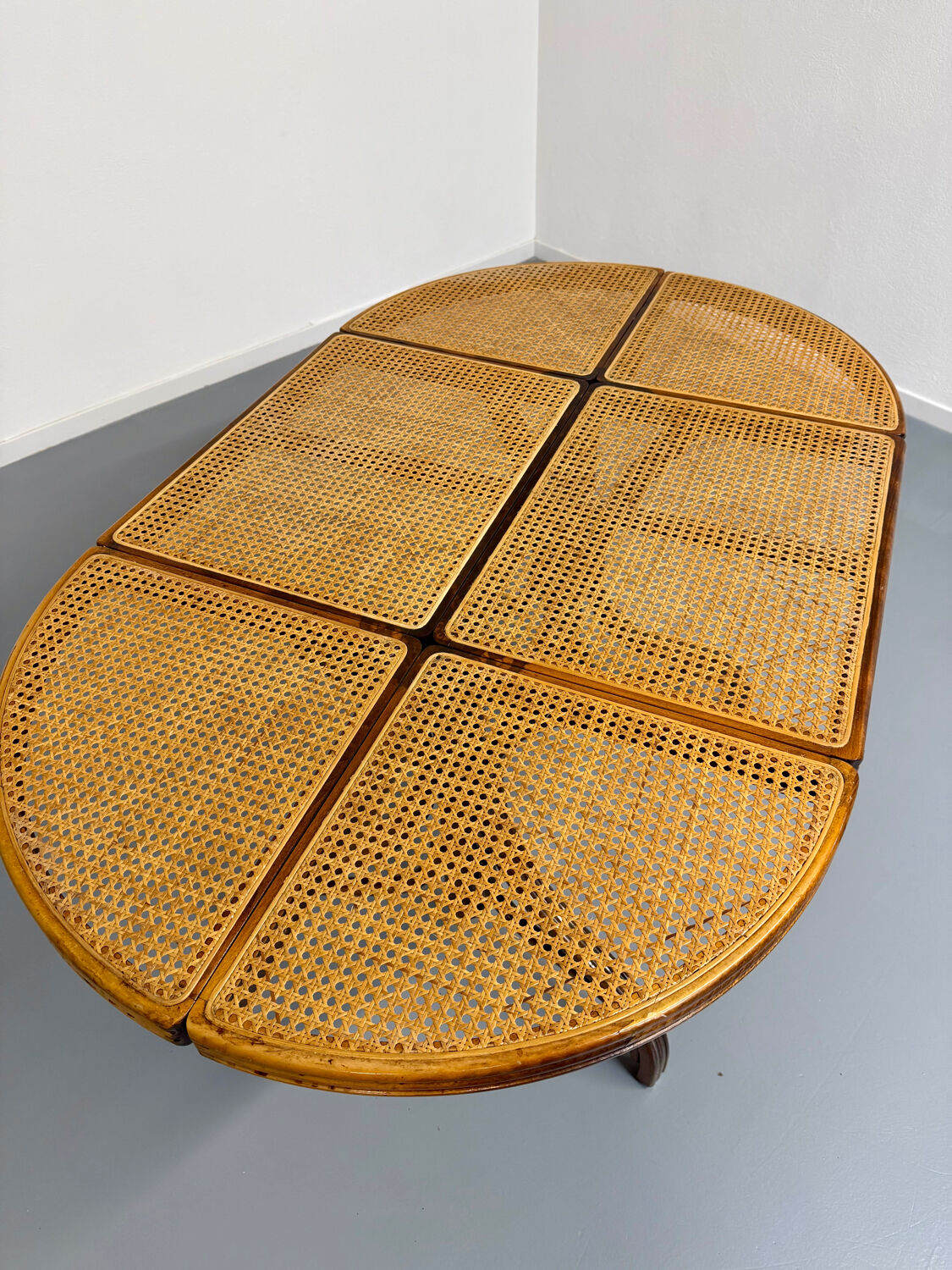 Vintage dining table with a cane top by Mundus from the 1970s.