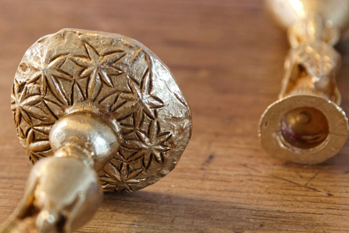 Pair of handmade candle holders, cast iron