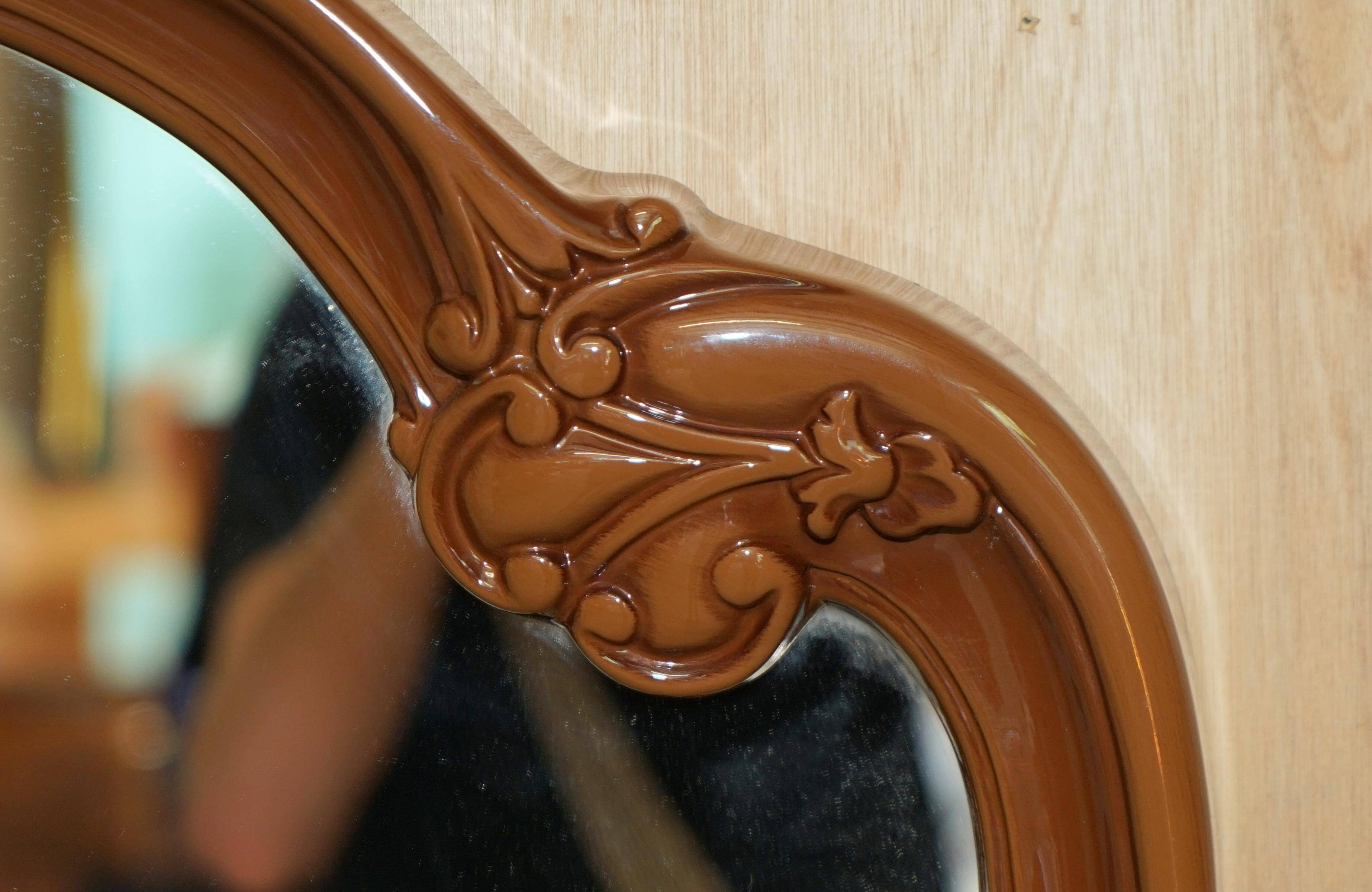 Vintage Art Deco decorative mirror with a thick frame.