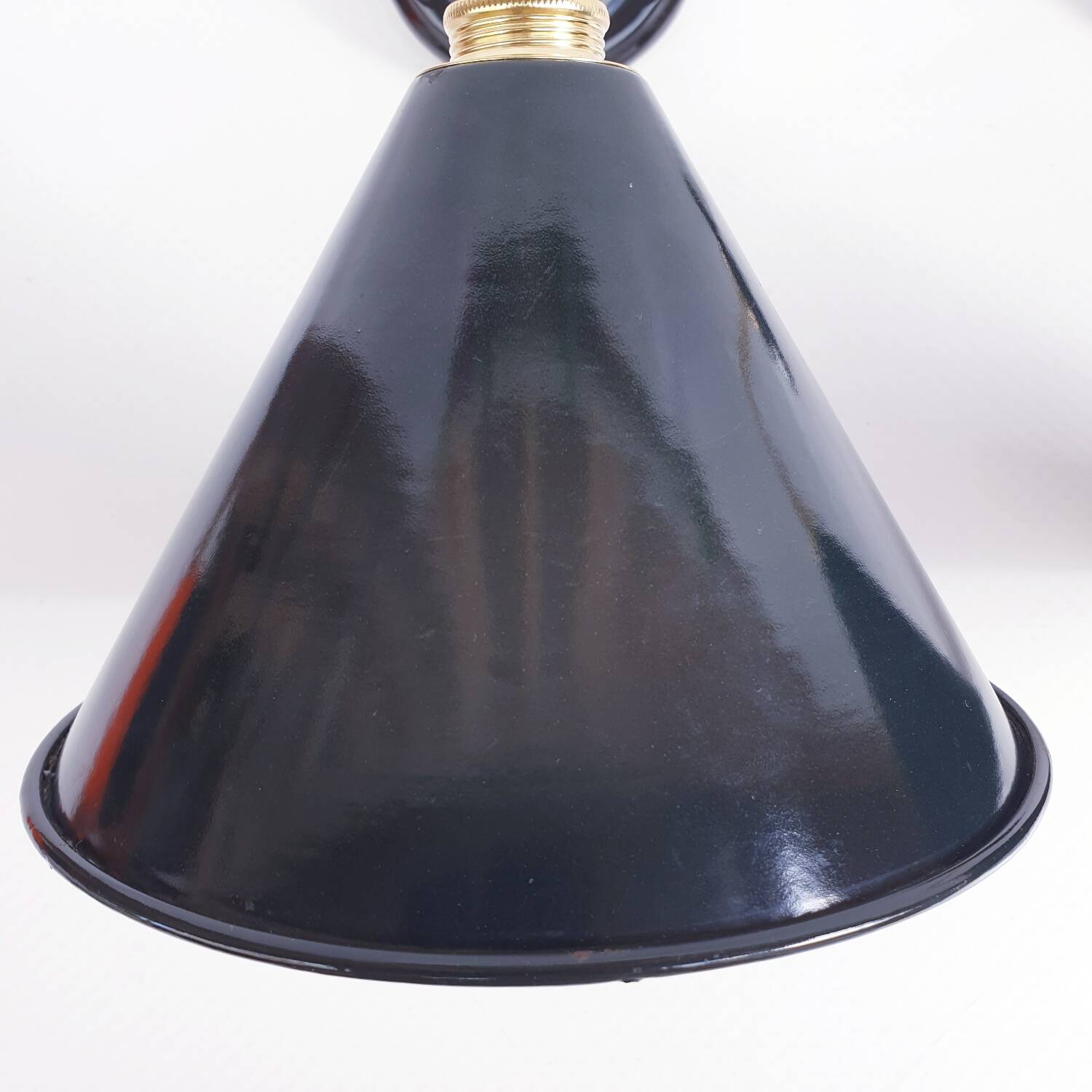 Pair of antique black enamelled sheet metal wall lights