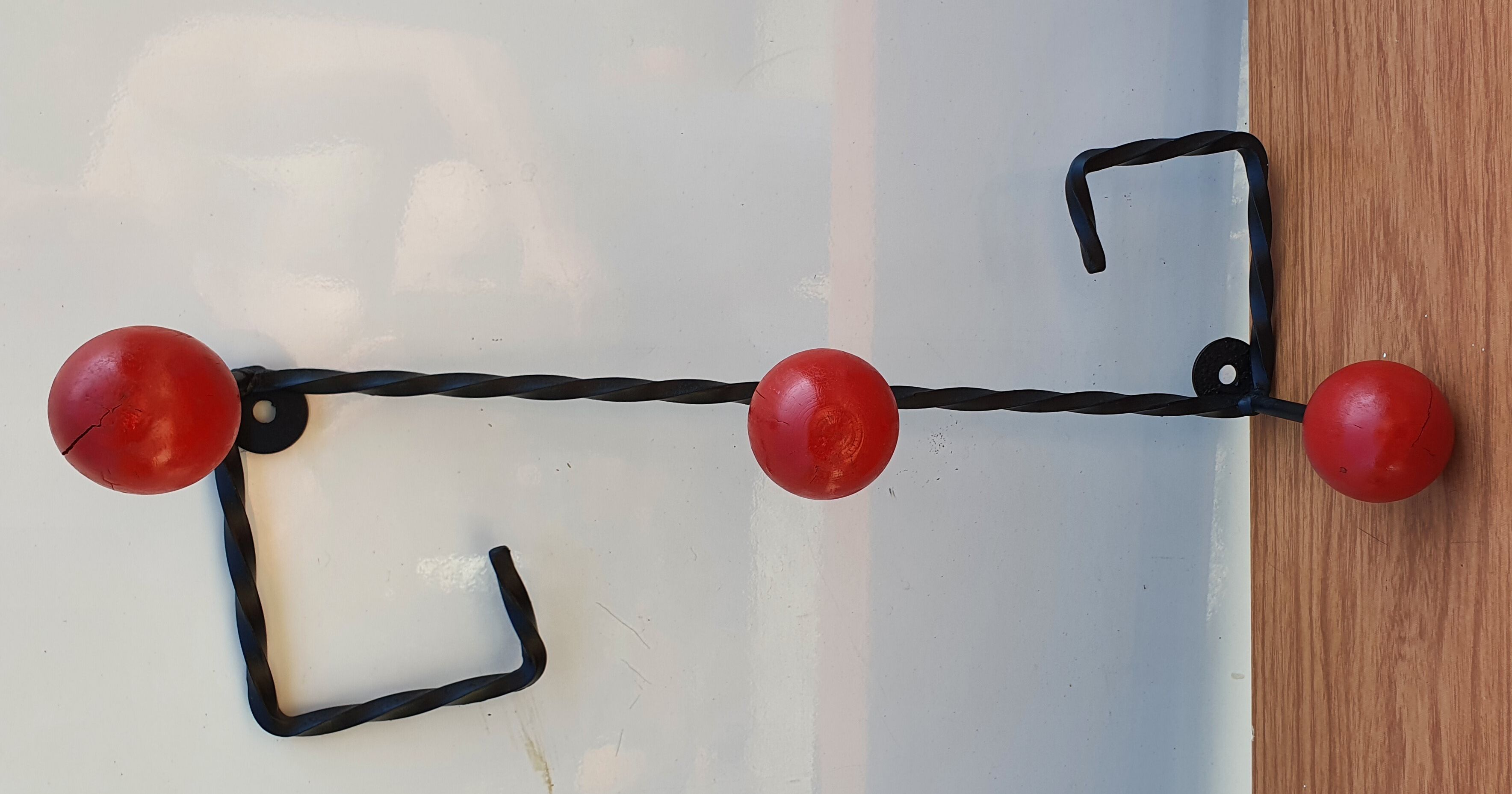 Coat rack wrought iron and red wooden balls