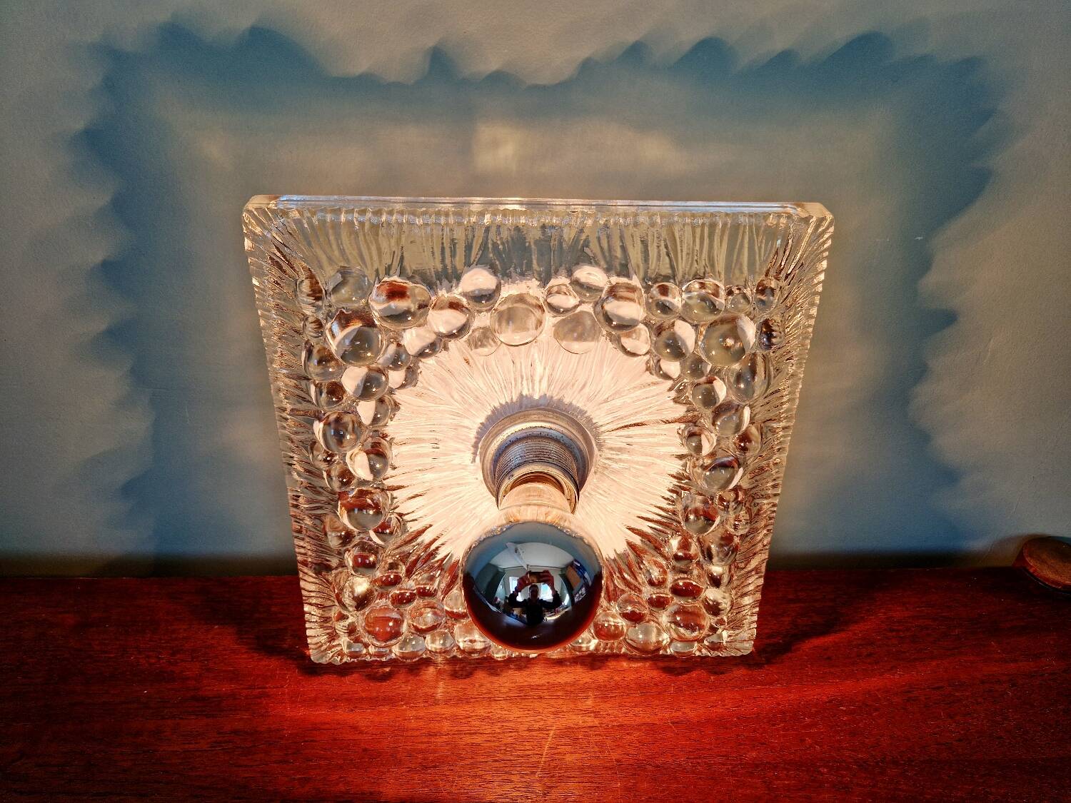 Space Age wall light in pressed transparent moulded glass, 1970.