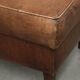 Sheepskin ottoman with a light brown colour scheme and a vintage look