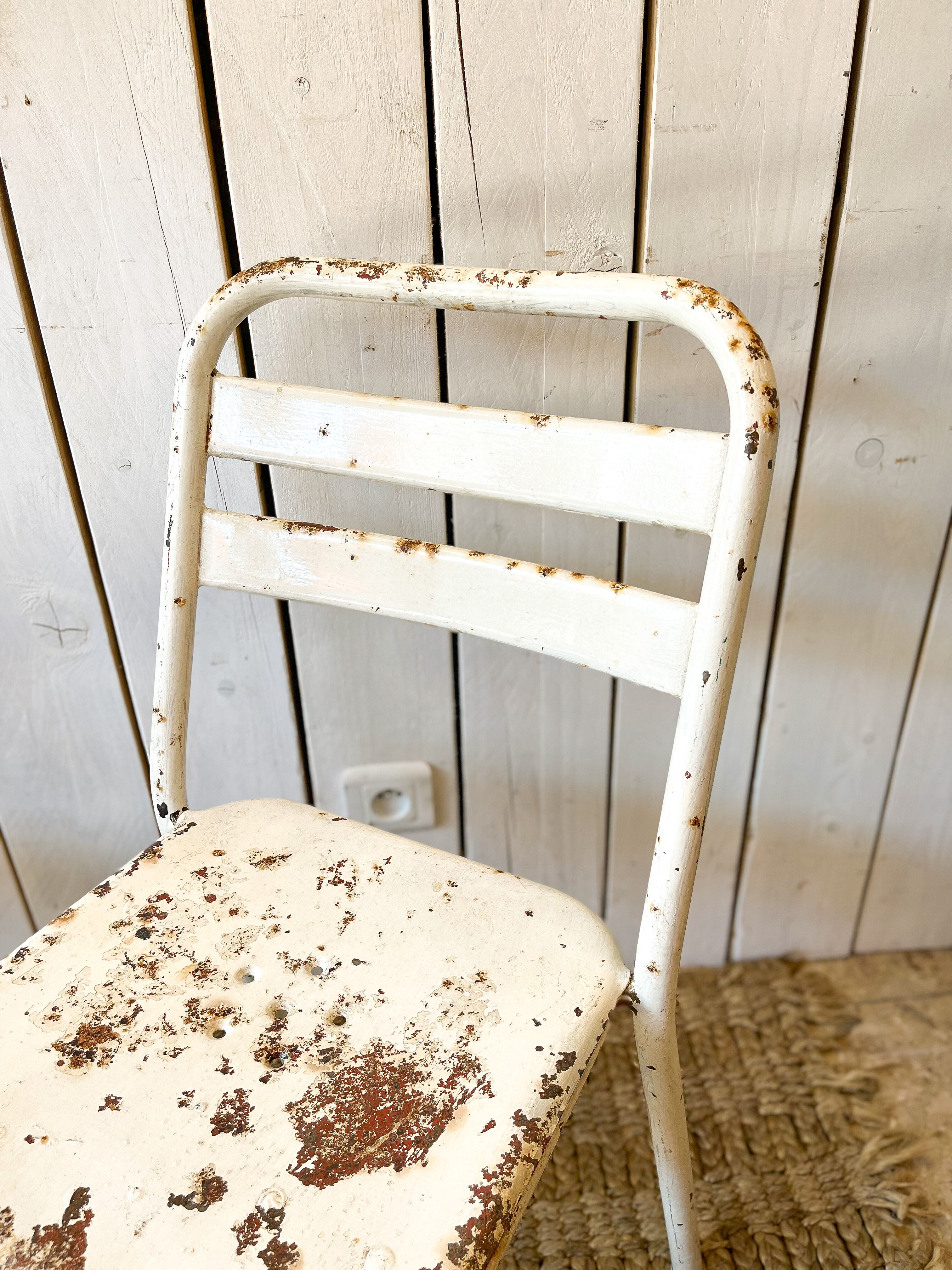 Pair of white metal bistro chairs