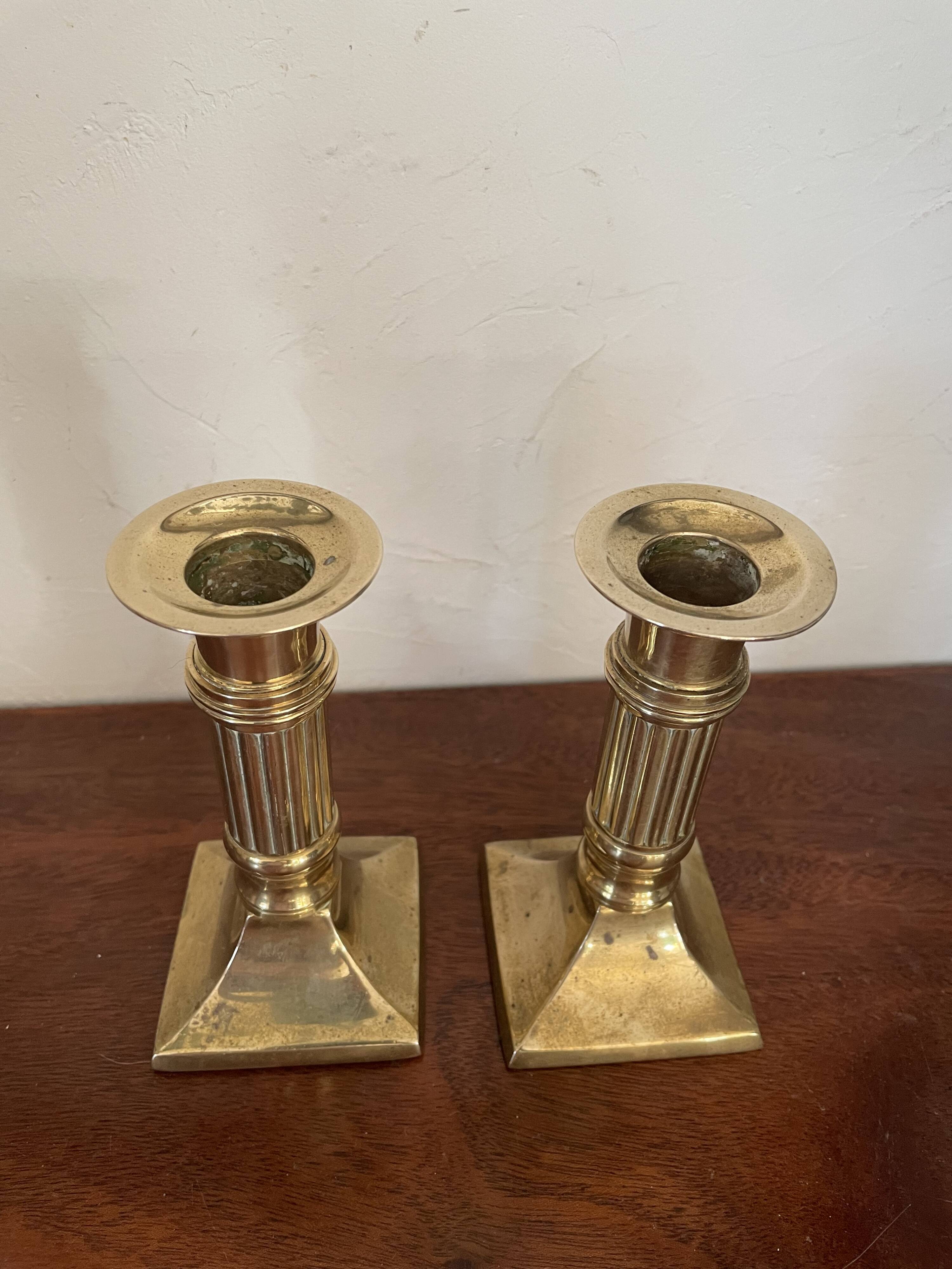 Pair of brass column candle holders