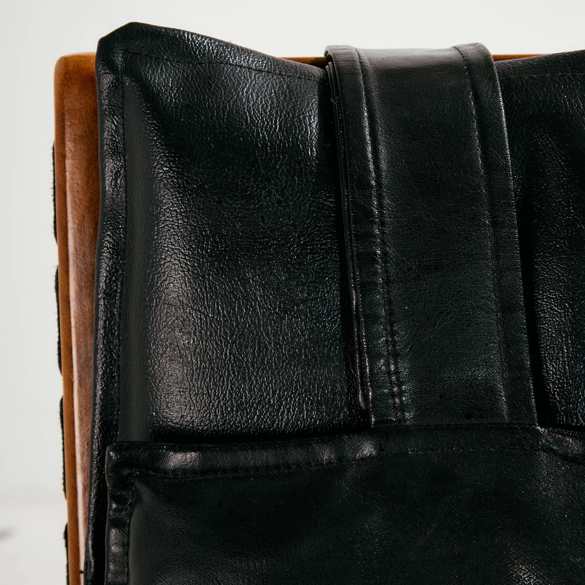 Beech armchair with leather upholstery