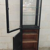 Old two-door shop showcase with black patina