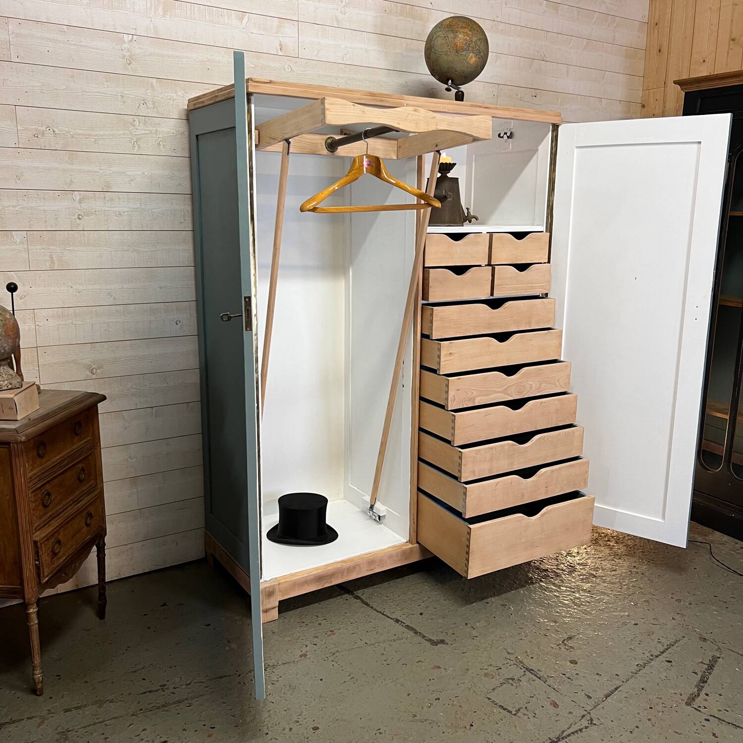 Wardrobe with two wardrobe compartments and drawers