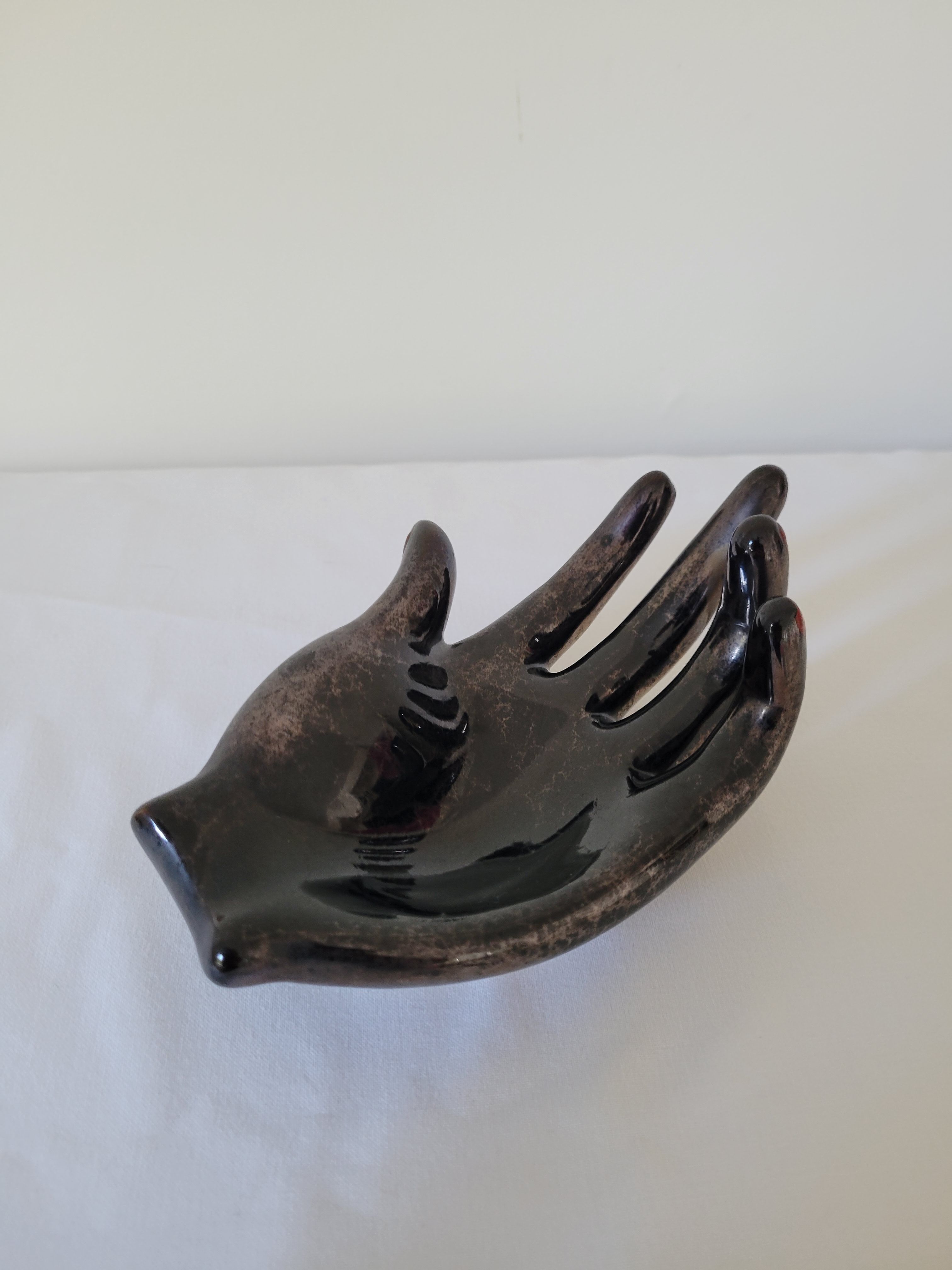 Empty pockets in the shape of a hand