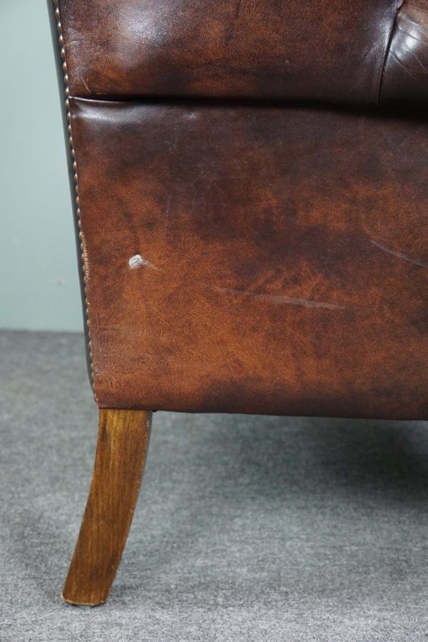 Chesterfield armchair with armrests