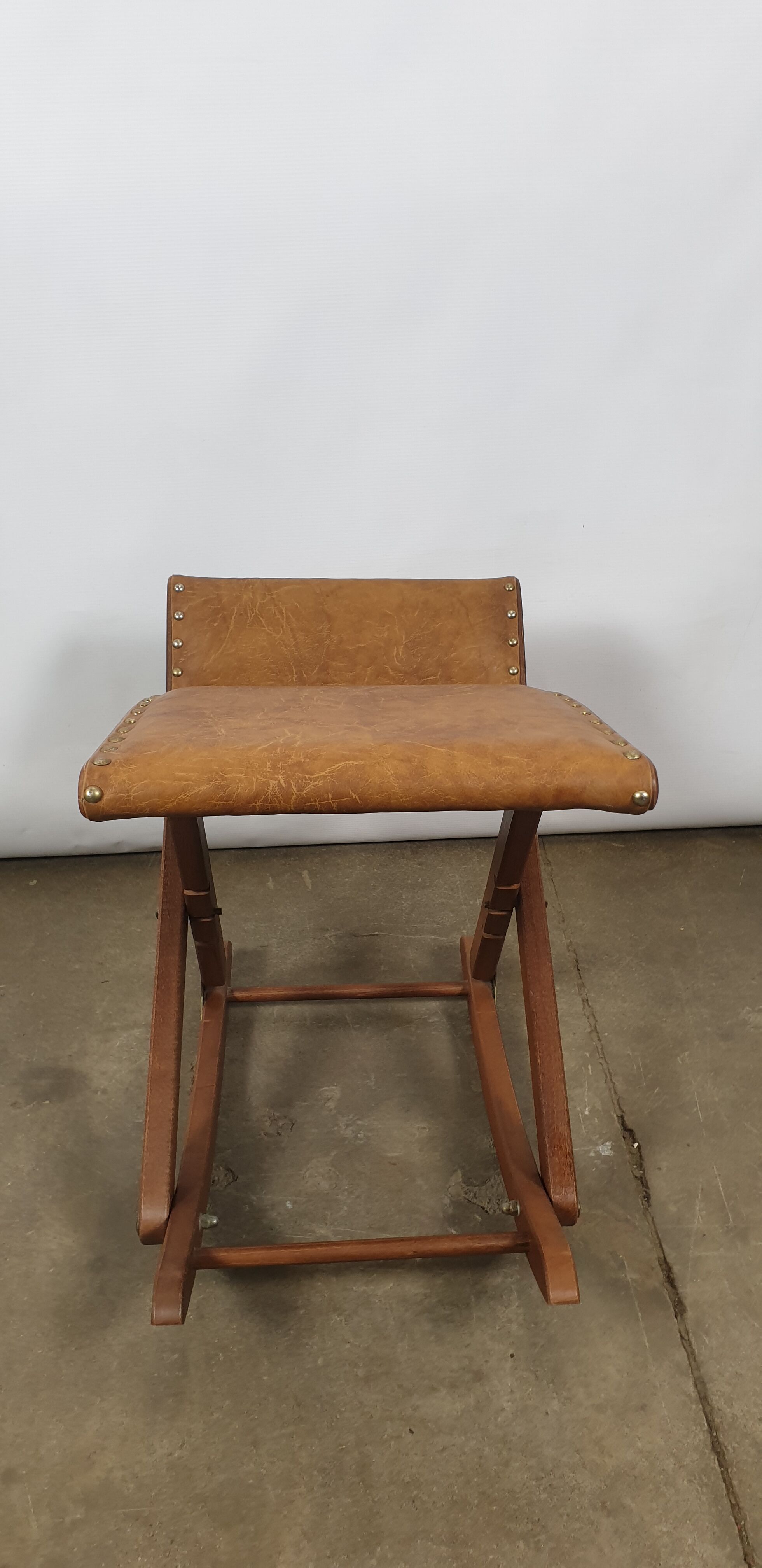 Wooden and leather folding rocking footring