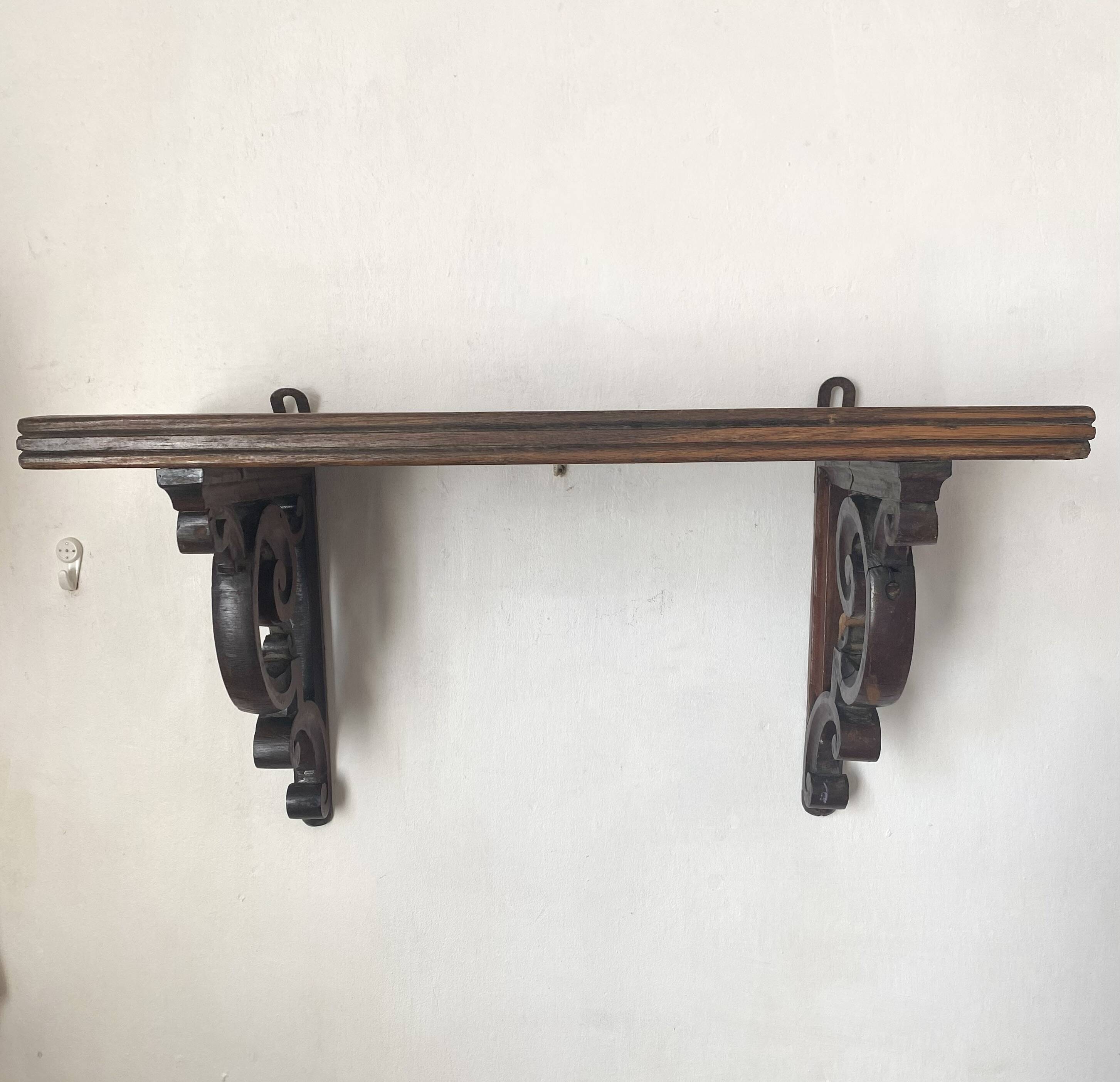 antique oak wall shelf with carved brackets