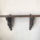 antique oak wall shelf with carved brackets