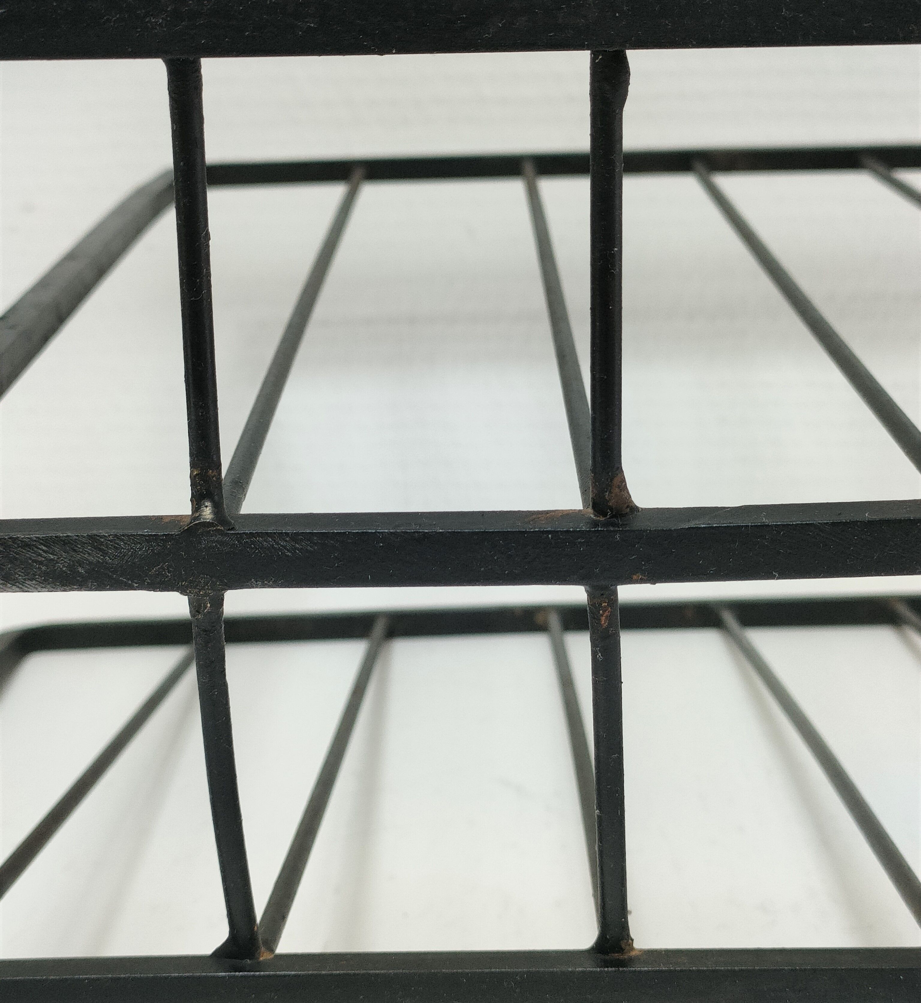 Modernist magazine holder black iron 60s