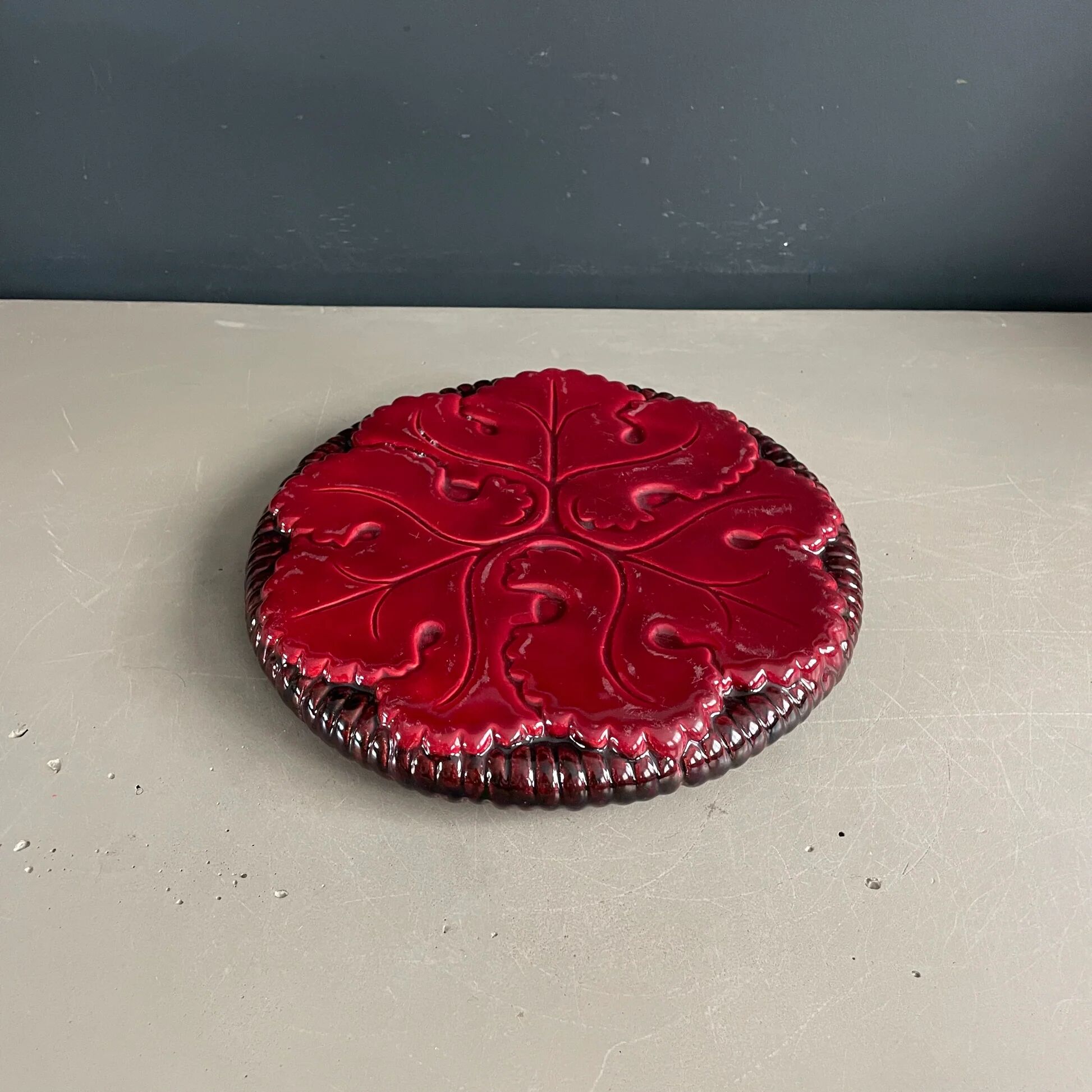 Burgundy ceramic trivet